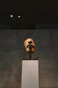 An exhibition of a face sculpture